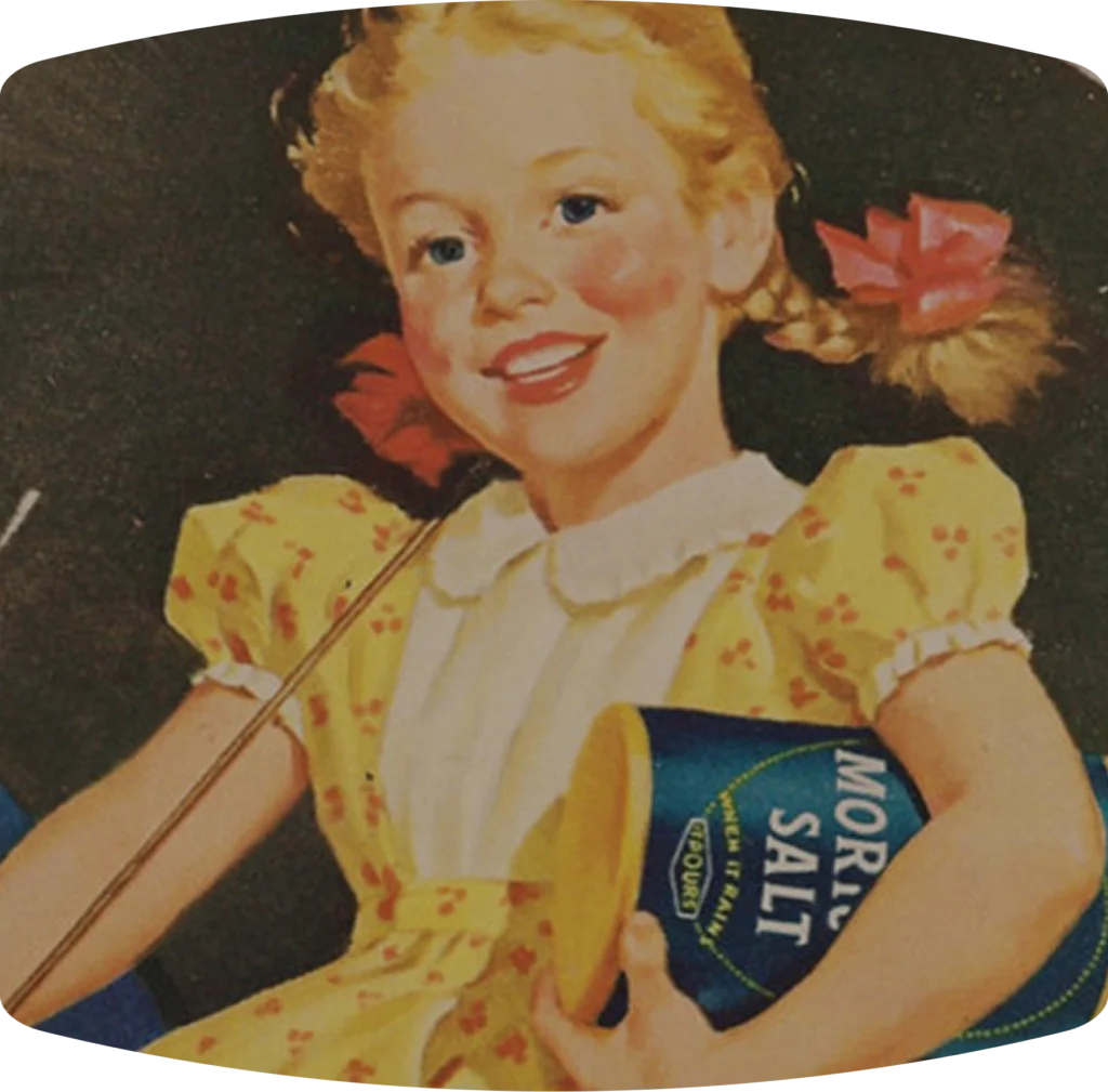 GIrl in a yellow dress with an umbrella carrying a morton salt container
