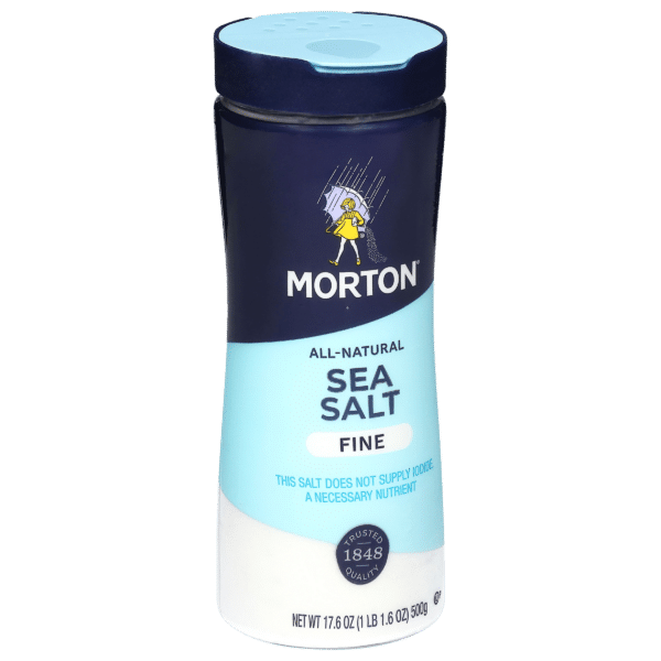 Morton all-natural fine sea salt container, 17.6 oz, featuring a blue design and a warning that the salt does not supply iodine, a necessary nutrient. Ideal for enhancing the flavor of various dishes.