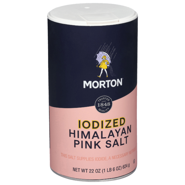 Morton Iodized Himalayan Pink Salt container, 22 oz, featuring a blue and pink design, highlighting its iodide content for nutritional benefits. Ideal for seasoning and enhancing flavors in cooking.