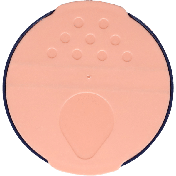 Round, peach-colored cosmetic container with a navy blue rim, featuring a smooth surface and a small applicator opening at the bottom, designed for makeup or skincare products.
