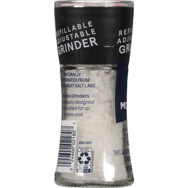 Refillable adjustable grinder containing salt, naturally evaporated from the Great Salt Lake, designed for multiple uses. Features a clear glass body and a black cap with product details. Ideal for enhancing flavor in cooking.