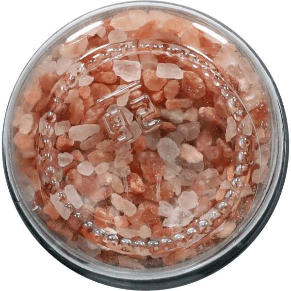 Himalayan pink salt in a clear container, showcasing coarse crystals with a mix of light pink and white hues, ideal for culinary use and health benefits.