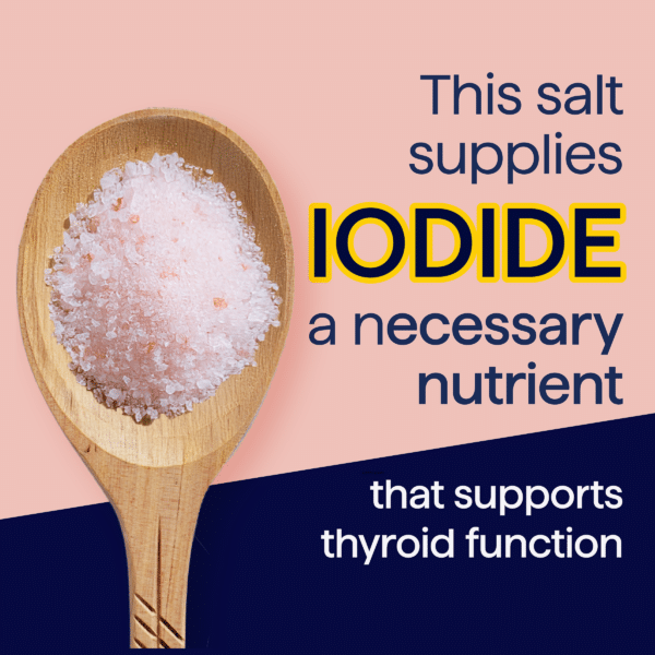 Wooden spoon filled with pink salt, highlighting its iodine content, an essential nutrient for thyroid function.