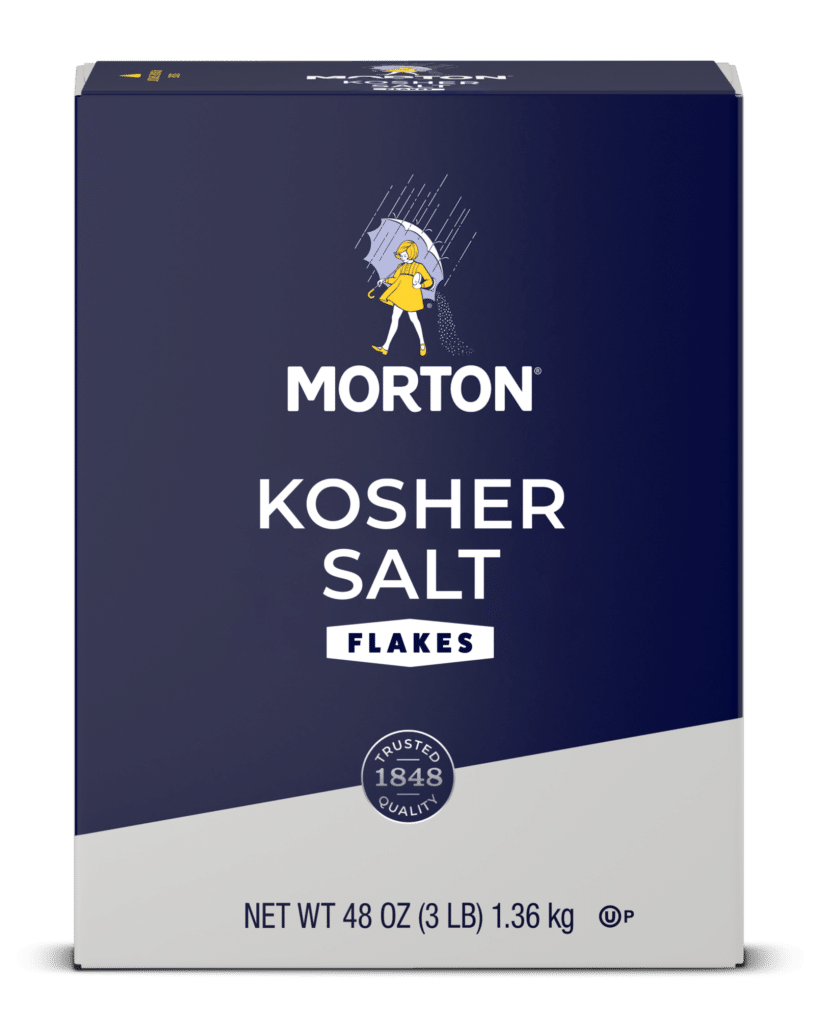 Morton Kosher Salt Flakes packaging, 48 oz (3 lb), featuring the brand logo and a graphic of a girl with an umbrella, highlighting trusted quality since 1848. Ideal for cooking and seasoning.