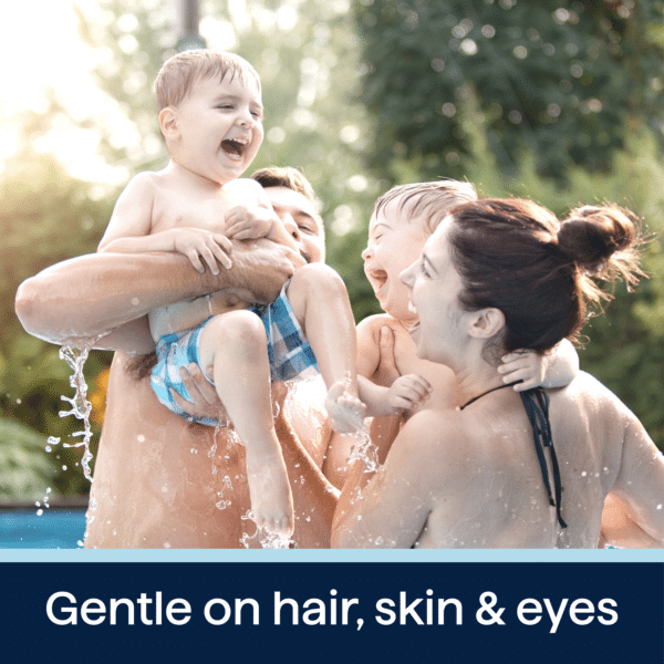 Family enjoying a playful moment in a swimming pool, with children laughing and splashing water, highlighting the gentle nature of products that are safe for hair, skin, and eyes.