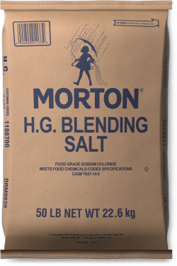 Brown paper bag of Morton H.G. Blending Salt, 50 lb (22.6 kg), labeled as food grade sodium chloride, meeting Codex specifications.