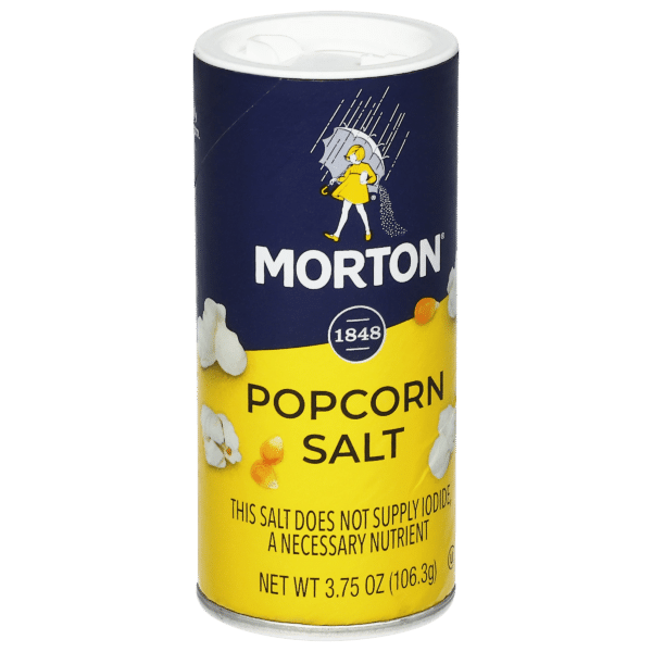 Morton Popcorn Salt container, 3.75 oz, featuring a blue and yellow design with popcorn graphics, highlighting that it does not supply iodide, a necessary nutrient. Ideal for enhancing the flavor of popcorn.