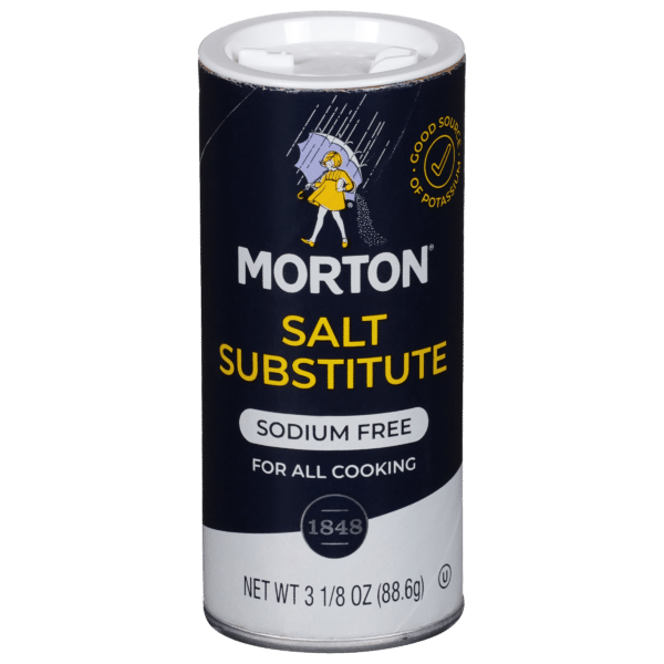 Morton Salt Substitute container, 3 1/8 oz, labeled as sodium-free and suitable for all cooking applications, featuring a graphic of a person with an umbrella.