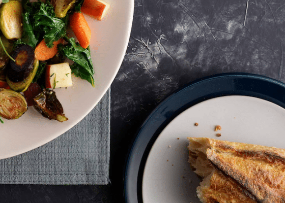 A plate of carrot and brussel sprout salad.