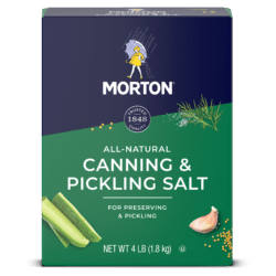 Morton all-natural canning and pickling salt packaging, 4 lb box, designed for preserving and pickling vegetables like cucumbers and garlic, featuring a colorful design with a logo and illustrations of herbs.
