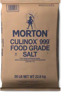 Brown paper bag of Morton CULINOX 999 food grade salt, 50 lb (22.6 kg), featuring blue text and an illustration of a chef. Suitable for food processing and cooking applications.