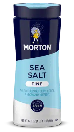 Morton Fine Sea Salt container, 17.6 oz, featuring a blue and white design, emphasizing its quality and non-iodized nature, ideal for cooking and seasoning.
