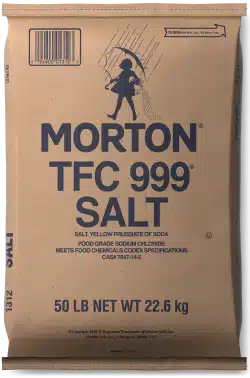Brown paper bag of Morton TFC 999 salt, containing 50 pounds (22.6 kg) of food-grade sodium chloride, labeled with product details and usage specifications.