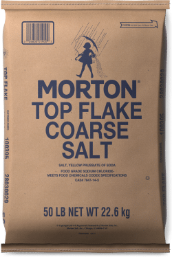 Bag of Morton Top Flake Coarse Salt, 50 lb (22.6 kg), featuring a brown paper packaging with blue text, suitable for culinary and food preservation uses.