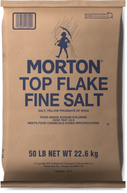 Brown paper bag of Morton Top Flake Fine Salt, 50 lb (22.6 kg), featuring product details and specifications for food-grade sodium chloride, suitable for culinary use.