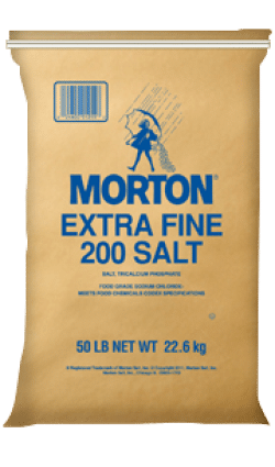 Brown paper bag of Morton Extra Fine 200 Salt, weighing 50 lbs (22.6 kg), featuring blue text and an illustration of a salt shaker. Ideal for culinary uses and food preservation.