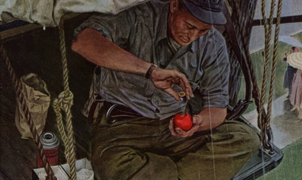 A man sitting on a swing, carefully applying salt to a red tomato, surrounded by supplies in a rustic setting. The image captures a moment of focus and craftsmanship, reflecting a blend of outdoor living and attention to detail.