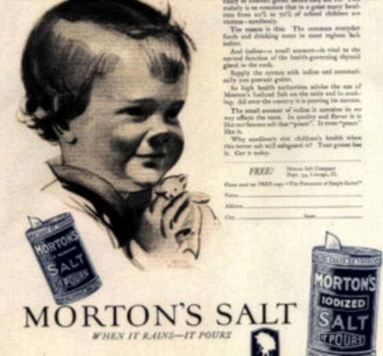 Vintage advertisement for Morton’s Salt featuring a smiling child, emphasizing the brand's tagline "When it Rains, It Pours." The design includes images of Morton’s salt containers and highlights the benefits of iodized salt for health.