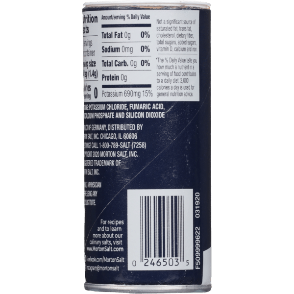 Nutrition facts label on a Morton Salt container, detailing serving size, ingredients including potassium chloride, and nutritional values such as 0g fat, 0mg sodium, and 0g protein. The label also includes a barcode and distribution information.