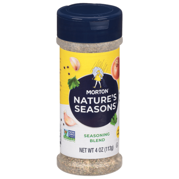 Morton Nature's Seasons seasoning blend in a 4 oz container, featuring a colorful label with illustrations of herbs and vegetables, ideal for enhancing the flavor of various dishes. Non-GMO verified product.