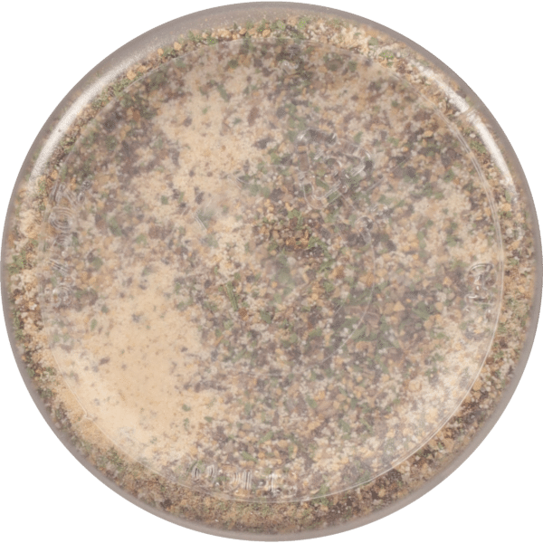 A close-up view of a round container filled with a mixture of spices and herbs, showcasing a variety of colors and textures, ideal for culinary use.