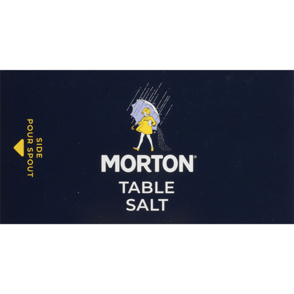 Morton Table Salt packaging featuring a classic design with a girl in a yellow dress holding an umbrella, set against a dark blue background. The label highlights the side pour spout for easy dispensing. Ideal for everyday cooking and seasoning.