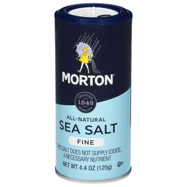Morton all-natural fine sea salt container, 4.4 oz (125g), featuring the brand's iconic logo and a note that it does not supply iodide, a necessary nutrient. Perfect for enhancing flavor in cooking and baking.