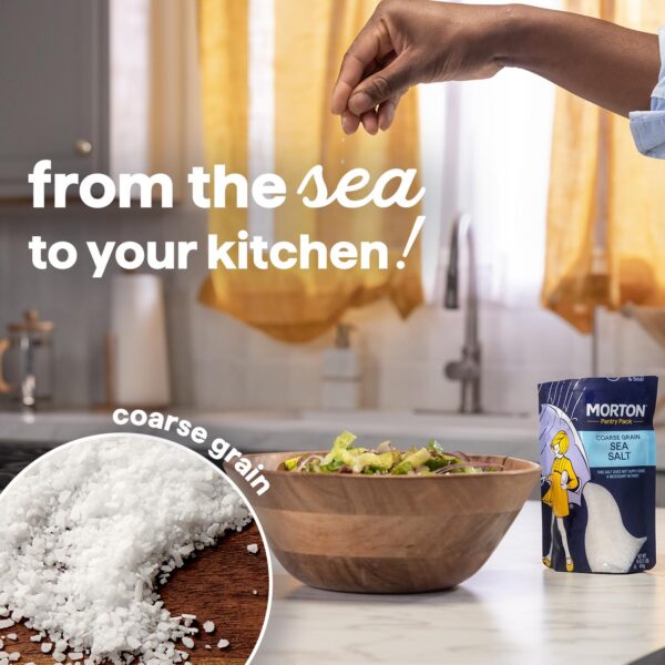 Hand sprinkling coarse sea salt from a Morton Pantry Pack over a fresh salad in a wooden bowl, showcasing the journey of sea salt from the ocean to home cooking.
