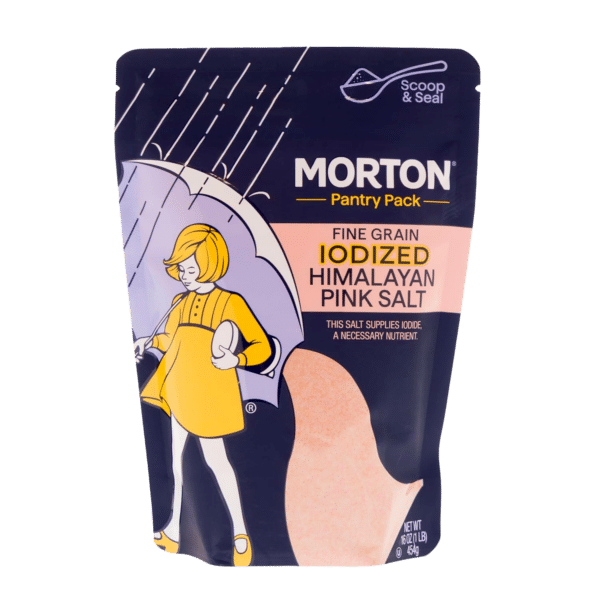 Morton Fine Grain Iodized Himalayan Pink Salt pantry pack, featuring a colorful illustration of a girl with an umbrella, highlighting its role as a source of essential iodine nutrients. Ideal for cooking and seasoning, this 16 oz package is designed for easy use and storage.