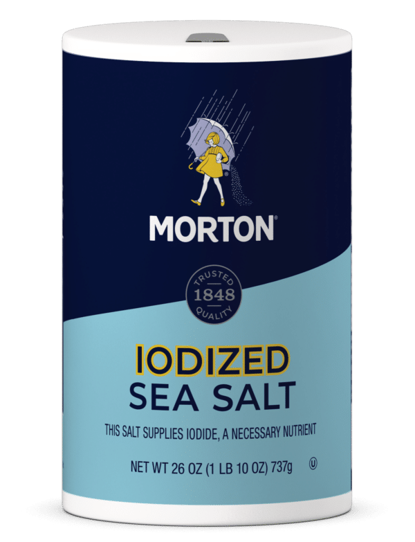 Morton iodized sea salt container, 26 oz, featuring a blue and white design with a girl in a yellow raincoat. The label highlights that the salt supplies iodide, an essential nutrient, emphasizing trusted quality since 1848.