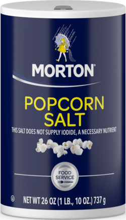 Container of Morton Popcorn Salt, 26 oz, designed for enhancing the flavor of popcorn. The label highlights that it does not supply iodide, a necessary nutrient, and indicates it is suitable for food service use.