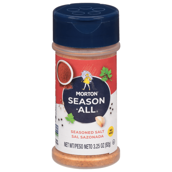 Morton Season-All seasoned salt container, 3.25 oz (92g), featuring a vibrant red label with the brand name, a character holding an umbrella, and a "No MSG" label. Ideal for enhancing the flavor of various dishes.