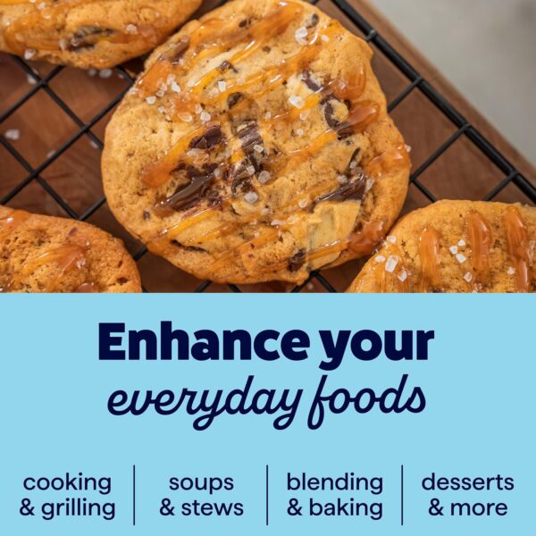 Freshly baked cookies drizzled with caramel and sprinkled with sea salt on a cooling rack, alongside text highlighting ways to enhance everyday foods through cooking, grilling, soups, stews, blending, baking, and desserts.