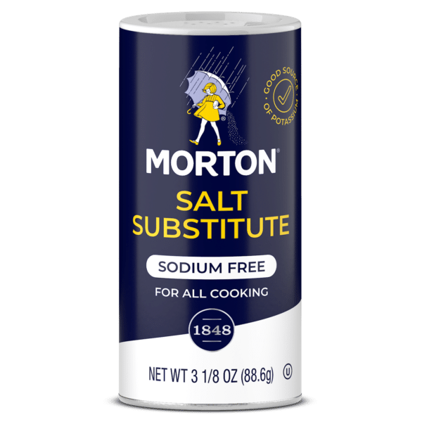Morton Salt Substitute container, 3 1/8 oz, labeled as sodium-free and suitable for all cooking, featuring a graphic of a girl with an umbrella.